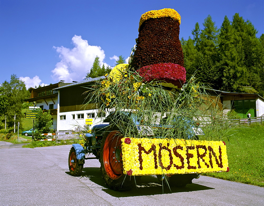 Parade float made of flowers, participant from Moesern, flower parade in Seefeld, Tirol, Austria