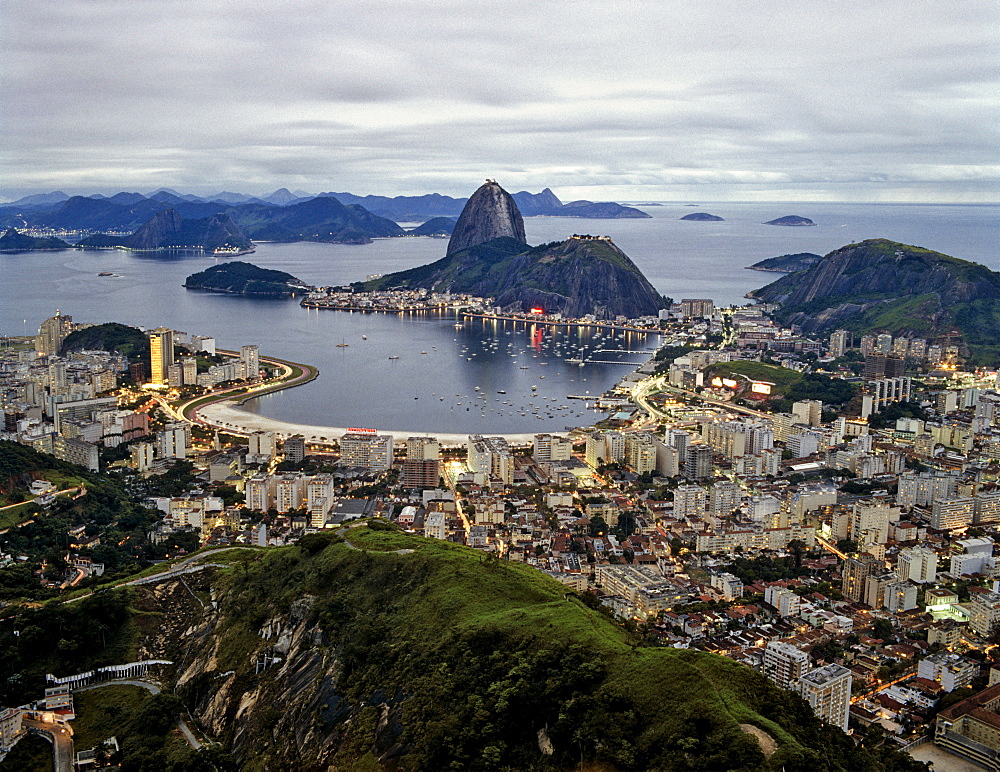 Rio de Janeiro viewed from Mt. Corcovado, Botafogo, Sugarloaf, Copacabana and Ipanema, twilight, Brazil, South America