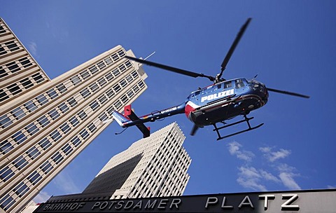 Police helicopter above Potsdamer Platz Square with the Beisheim Center, Berlin, Germany, Europe