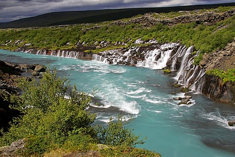 Hvita-River with Hraunfossar-Waterfalls (Lava-Waterfalls) at the right side near by the Langjoekull-Glacier in Iceland