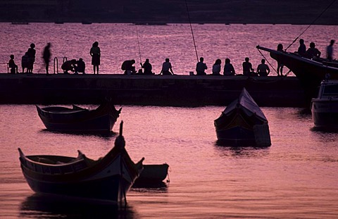 St. Paul's Bay, angler at the jetty, St. Paul's Bay, Malta