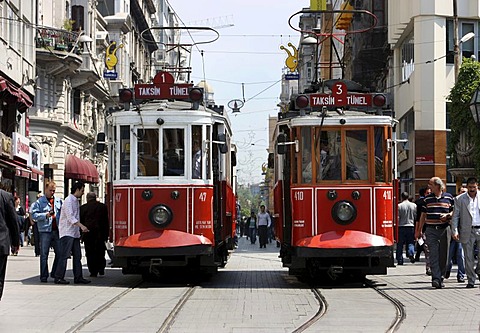 Trams passing through the main pedestrian zone, Istiklal Caddesi in the Boyoglu district, Sultanahmet, Istanbul, Turkey