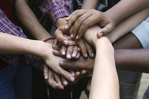 Indian and German hands on top of each other in friendship