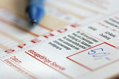 DEU, Germany : bank transfer form for a donation to a voluntary organization. Symbolic photo economy