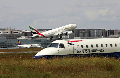 DEU, Federal Republic of Germany, Frankfurt: Frankfurt-Main airport, Fraport. Airbus A330 plane, Emirates airline, during take off. British Airways plane on the taxiway.