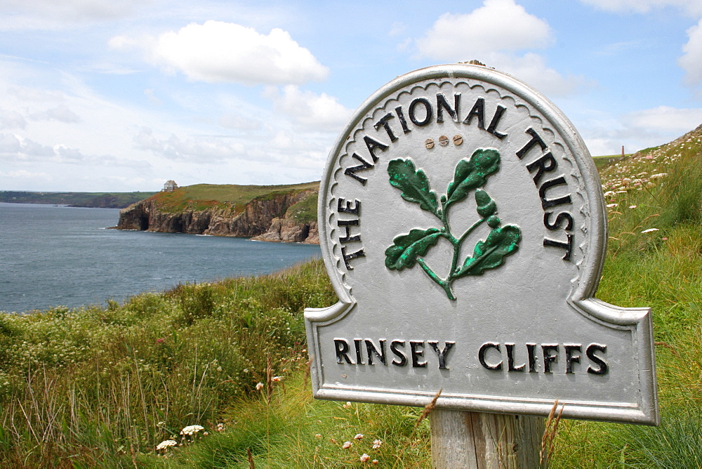 Sign " The National Trust" at the Rinsey Cliff, Cornwall, UK