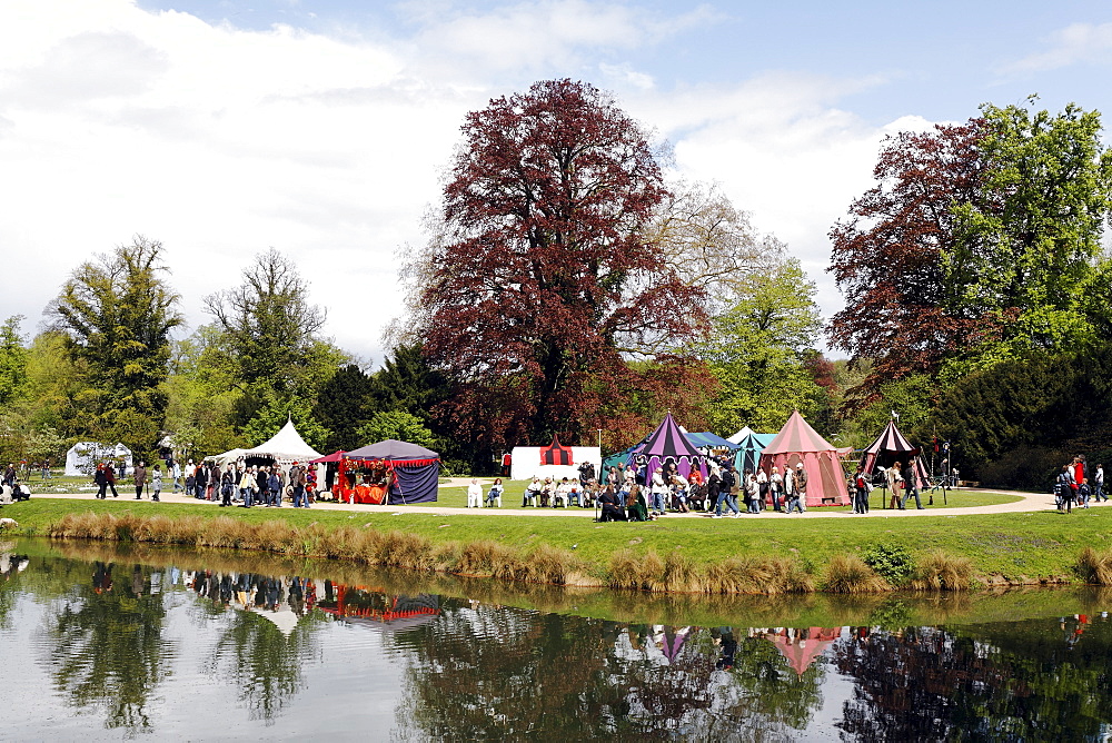 Mediaeval tent camp and stalls in the palace gardens, Renaissancefest or Renaissance Festival at the moated castle Wasserschloss Dyck, Juechen, Rhineland, North Rhine-Westphalia, Germany, Europe