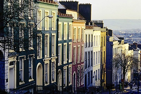 Row of houses in a steep street, pastel coloured facades, Cork, Ireland, Europe