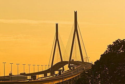 Koehlbrandbruecke at river Suederelbe at sunset, Hamburg, Germany