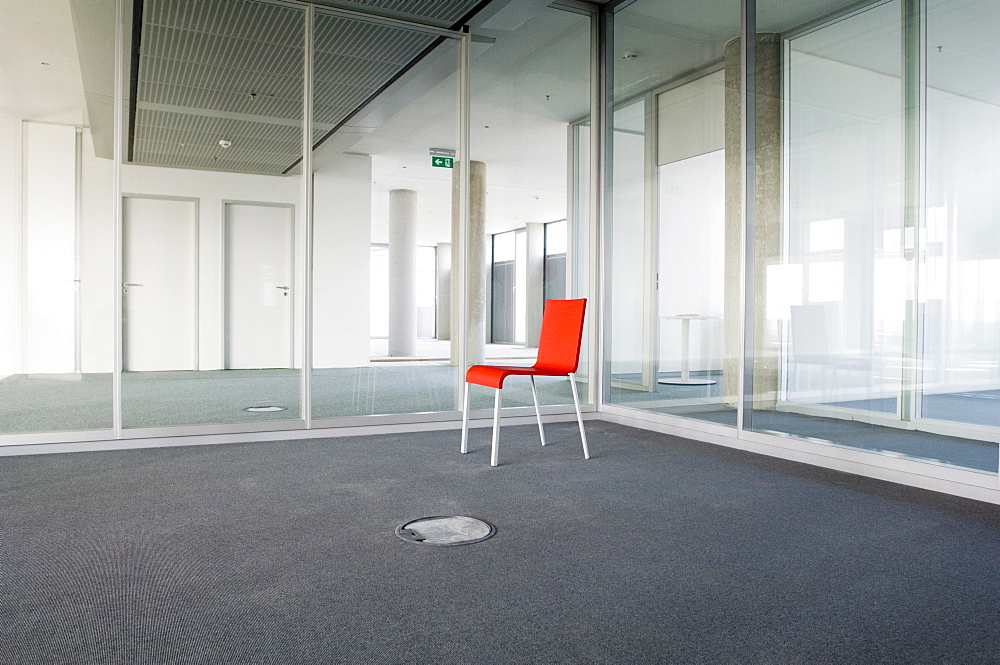 Red empty chair in a room