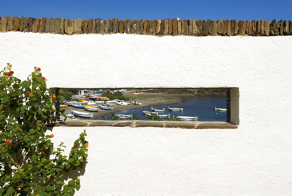 Bay viewed through a rectangular panorama window on the former house of surrealist painter Salvador Dali and his wife Gala in Port Lligat near Cadaques, Catalonia, Spain