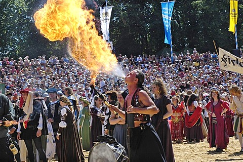 Fire-eater at move of the comedians in mediaeval medieval costume in arena, knight festival Kaltenberger Ritterspiele, Kaltenberg, Upper Bavaria, Germany