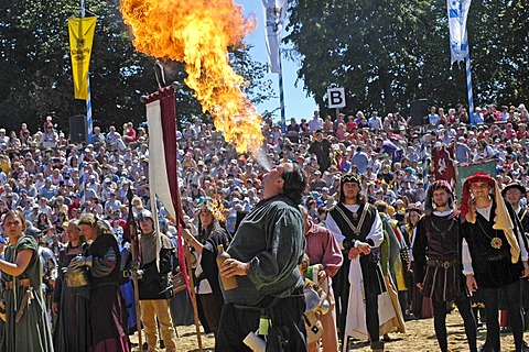 Fire-eater at move of the comedians in mediaeval medieval costume in arena, knight festival Kaltenberger Ritterspiele, Kaltenberg, Upper Bavaria, Germany