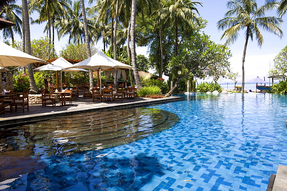 Swimming pool complex and terrace restaurant of the Sheraton Hotel near Senggigi, Lombok Island, Lesser Sunda Islands, Indonesia