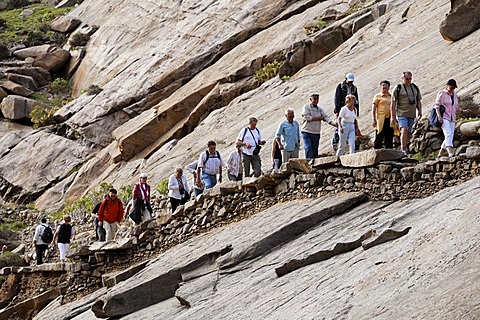 Hiker group in Barranco de las Penitas near Vega de Rio Palmas, Fuerteventura , Canary Islands