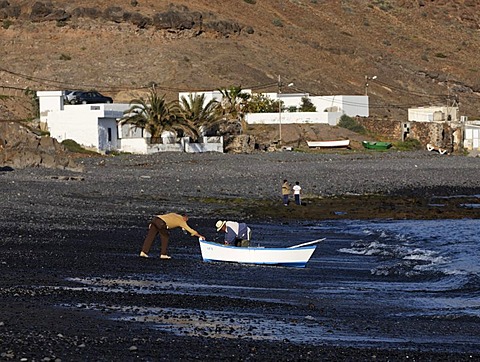 Two fishermen disembarking , Lajita , Fuerteventura , Canary Islands