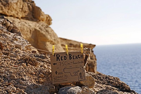 Sign and warning Red beach in Matala, Southcrete, Crete, Greece