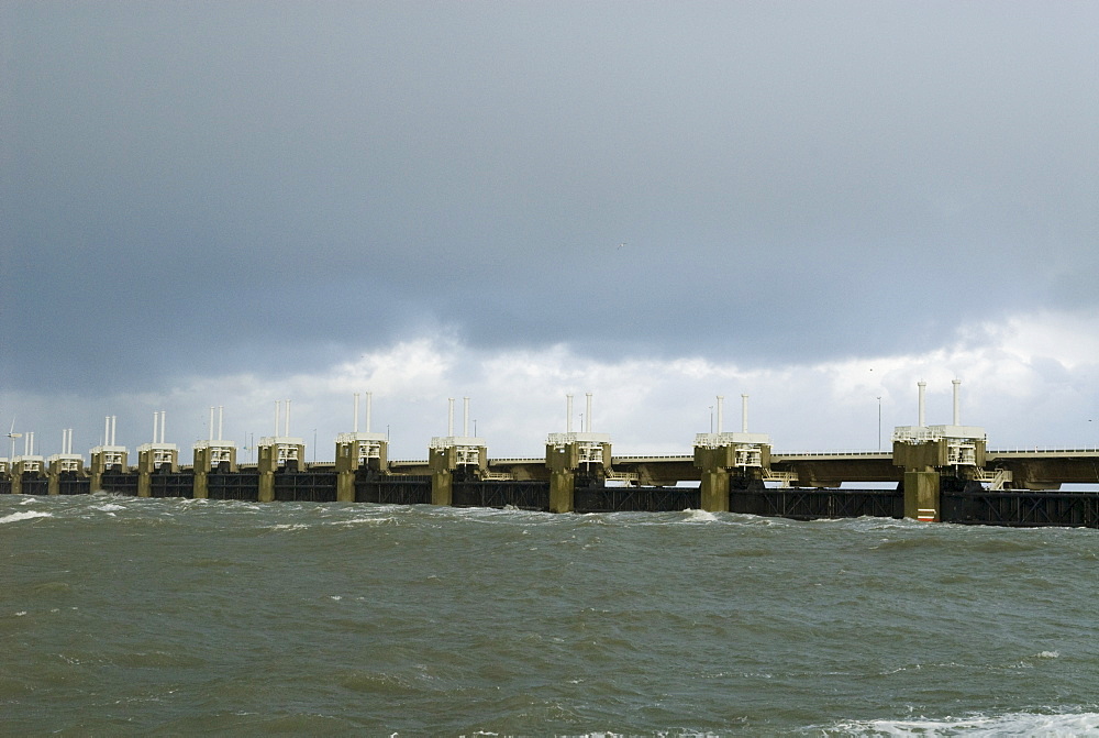 Closed storm surge barrier The Oosterscheldekering (Eastern Scheldt storm surge barrier) between the islands Schouwen-Duiveland and Noord-Beveland, part of the Delta works series of dams, protecting the Netherlands from flooding, Netherlands