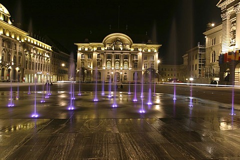 The 26 water fountains, symbolizing the 26 federal cantons, on the main square in front of the Swiss state house, the "Bundeshaus" in Bern. The square is laid out with granite from Vals in the canton grisons, Switzerland.