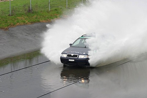 Aquaplaning area in a driving safety center. Emergeny situations in deep water are practiced here. They can occur on highways after heavy rain, when vehicles at high speed hit deep water that cannot be dipslaced by the tires.