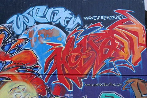 Colorful graffiti in an industrial quarter of Zurich near the train viaduct of Wipkingen.