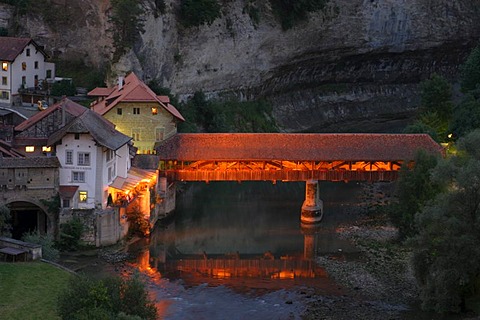 Covered bridge over the Saane River, border of the famous "Roestigraben", the language divide in Fribourg canton, Switzerland