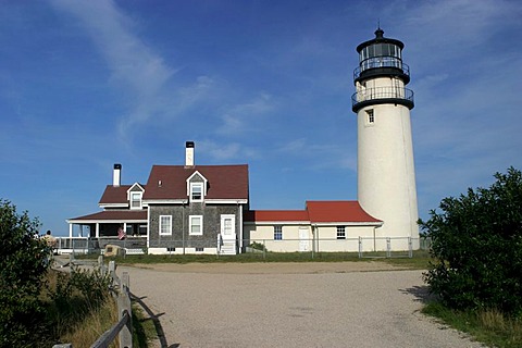 Highland Light (Cape Cod Light). The station was established in 1797, the present buildings date from 1857. At that time, the lighthouse was still 150m away from the 40m cliffs, but continuing erosion imperiled the location. At the end of the 20th century