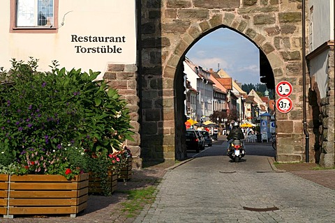 A motor scooter drives through one of the town gates to historic Villingen, Villingen-Schwenningen, Baden-Wurttemberg, Germany