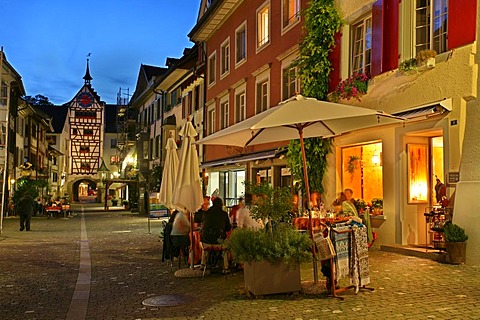 Restaurants, timber-framed houses and the tower of the Untertor gate in the historic old town of Stein am Rhein, Schaffhausen, Switzerland