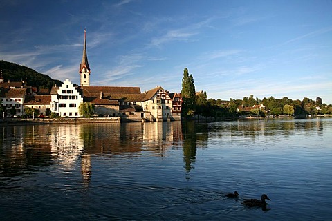 Abbey St. George on the orographic right river side of the Rhine river, with the town church in the background, Stein am Rhein, Schaffhausen, Switzerland