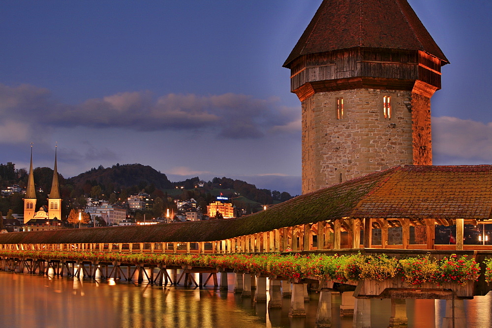 Historic Kapell Bridge, Water Tower and Hofkirche Church (in background), Lucerne, Switzerland