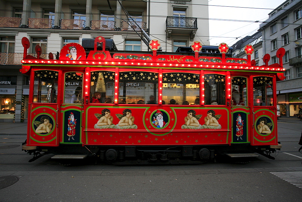 Historic fairytale tram on a round course in downtown Zurich from Bellevue - Limmatquai - Bahnhofstrasse, Zurich, Switzerland