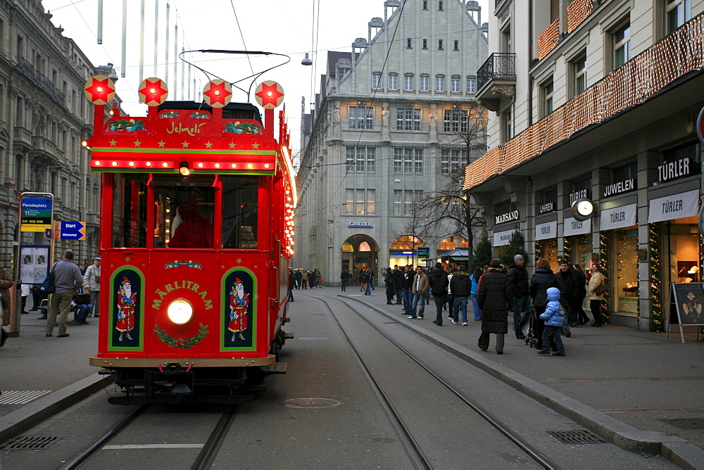 Historic fairytale tram on a round course in downtown Zurich from Bellevue - Limmatquai - Bahnhofstrasse, Zurich, Switzerland