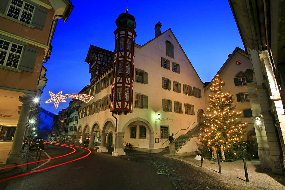 Christmas illumination on main street with historic houses and town hall of Lichtensteig, St. Gall, Switzerland