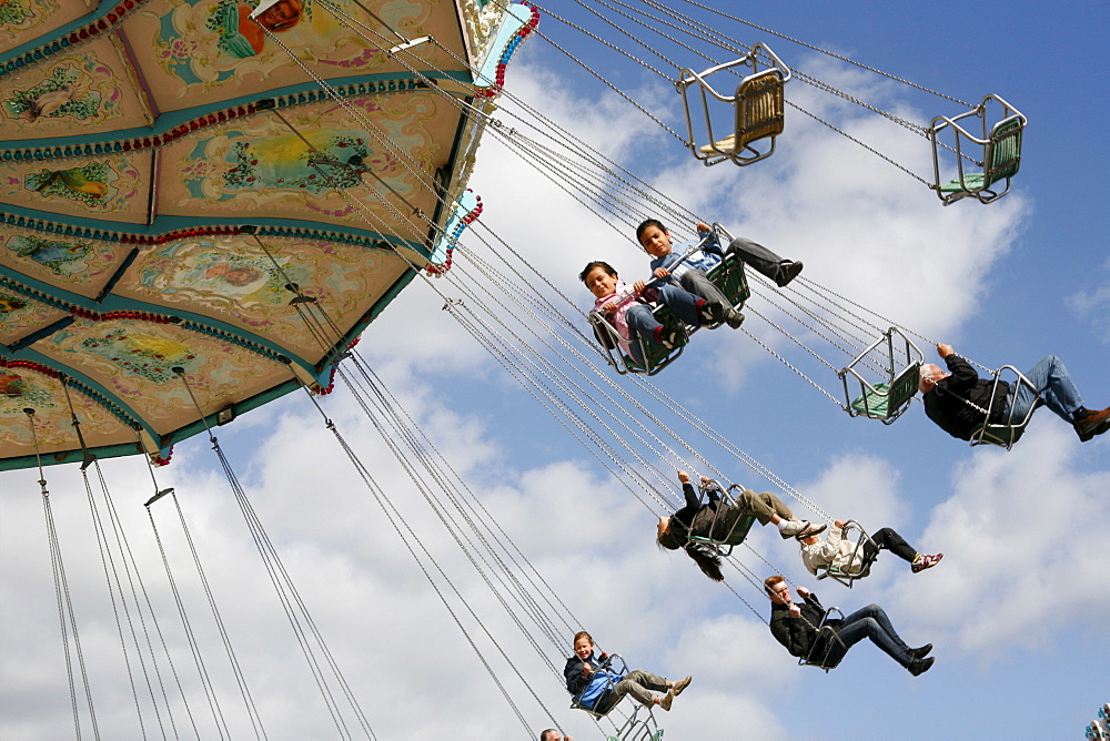 People driving with a chairoplane, Hamburg, Germany