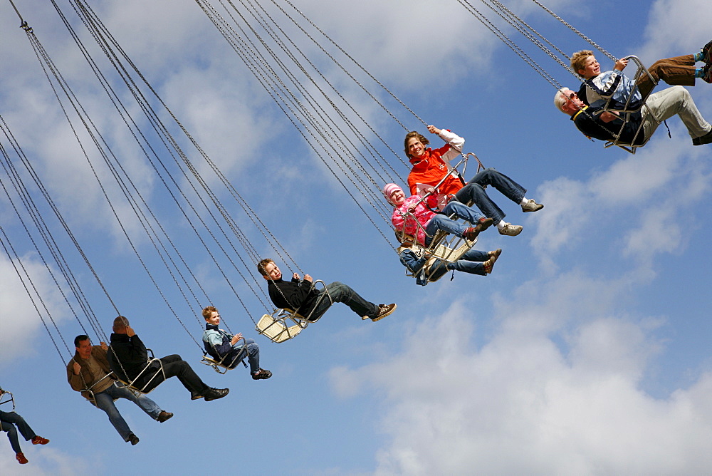 People driving with a chairoplane, Hamburg, Germany