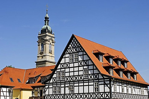 Half-timbered house in front of the bell tower of the Georgenkirche Church in Eisenach, Thuringia, Germany, Europe