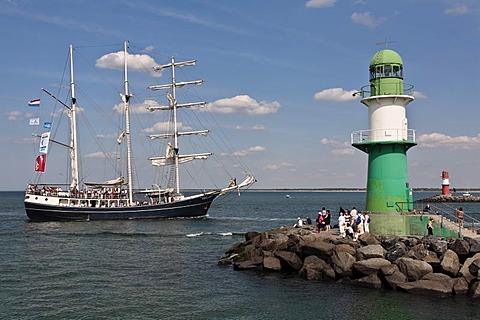 Barkentine named Thalassa next to the lighthouse of the Westmole, Hanse Sail 2008 in Warnemuende, Mecklenburg-Western Pomerania, Germany, Europe