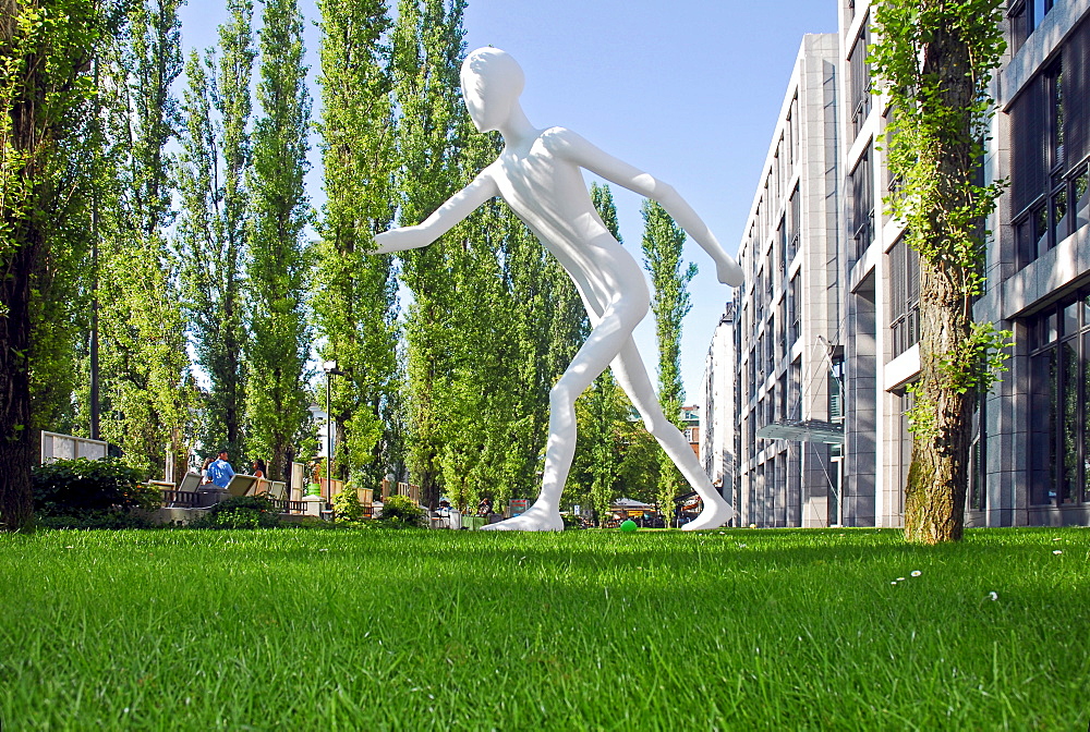 Walking Man, Sculpture in front of the building of the Muenchener Rueckversicherung, Leopoldstrasse, Munich, Bavaria, Germany