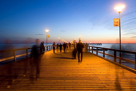 Vacationers on the old pier in Palange, Lithuania