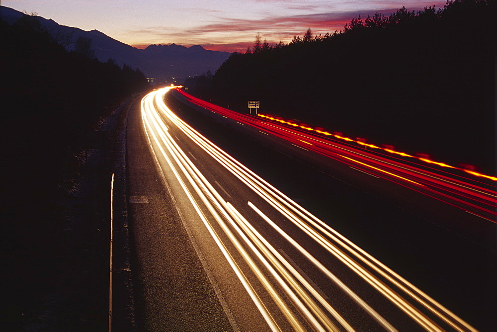 Traffic at dusk, Inn Valley autobahn, North Tirol, Austria, Europe