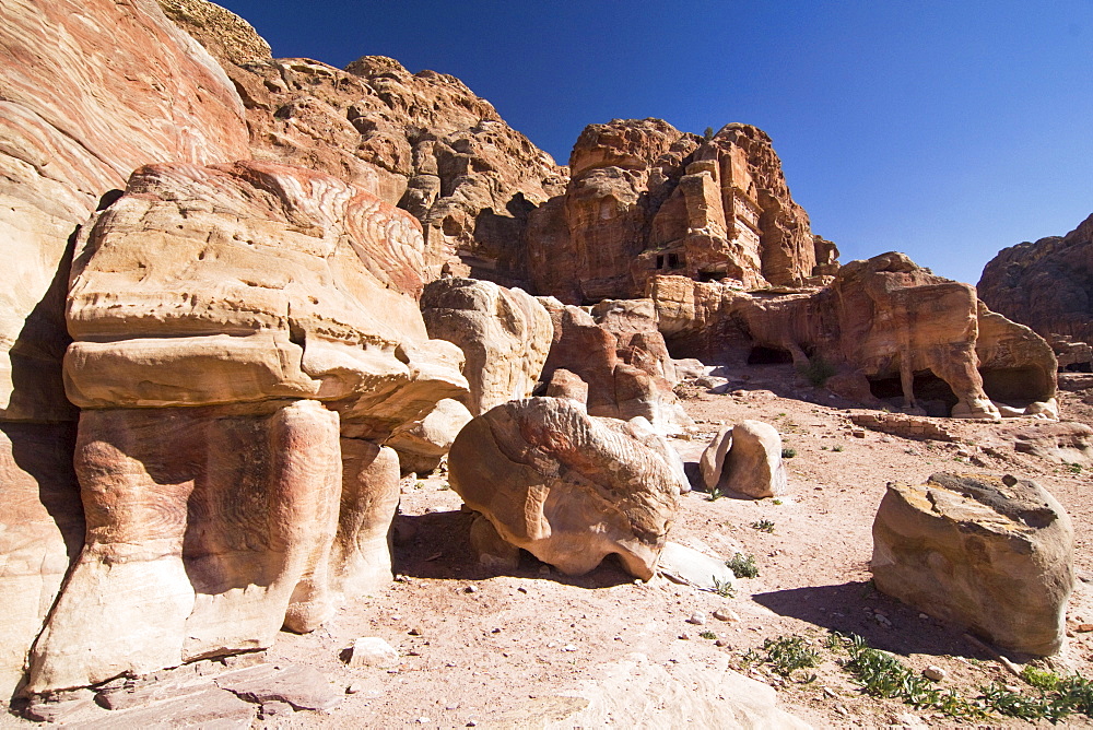 Tombs cut into cliffs, rock face in Petra, Jordan, Middle East