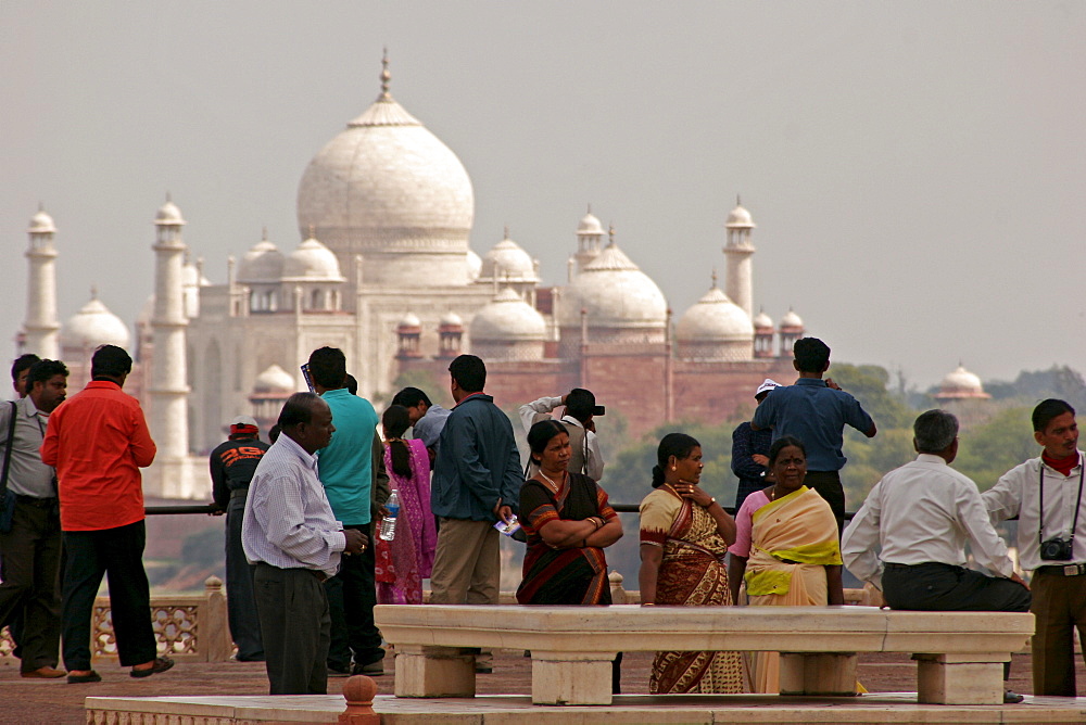 Indian tourists visiting the Red Fort of Agra, with the Taj Mahal in the background, Agra, Uttar Pradesh, India, Asia