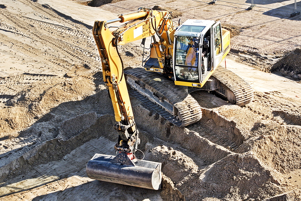 Excavator at a construction site, Hamburg, Germany, Europe