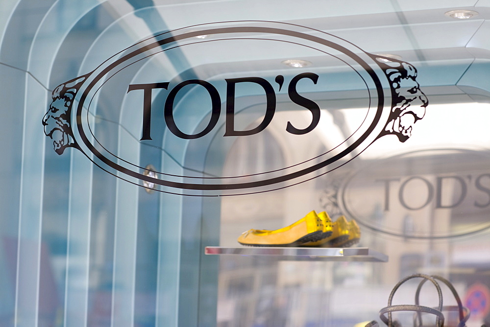 Yellow ballerina shoes in the window display of Tod's fashion boutique on the Maximilianstrasse, Munich, Bavaria, Germany