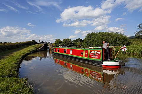 Boat in chanal in front of lock, Cheshire, England