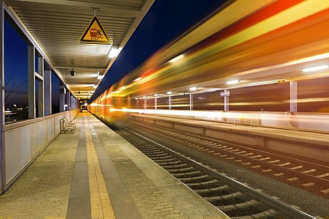 Station, Platform, province. train passing the station, evening