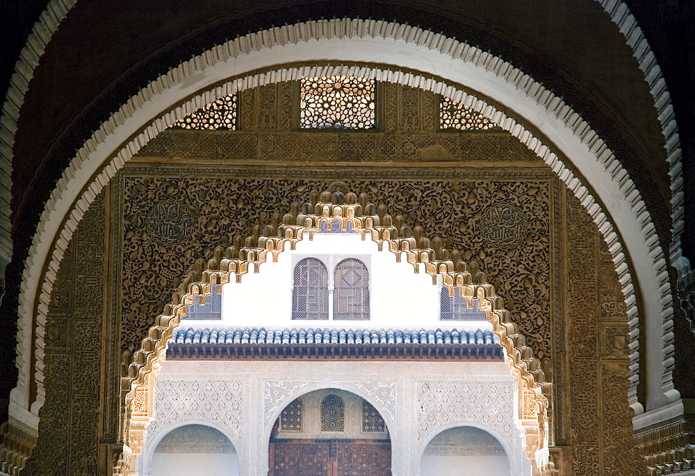 Highly ornate Moorish arches, intricate wood carving in the Alhambra fortress, Granada, Andalusia, Spain