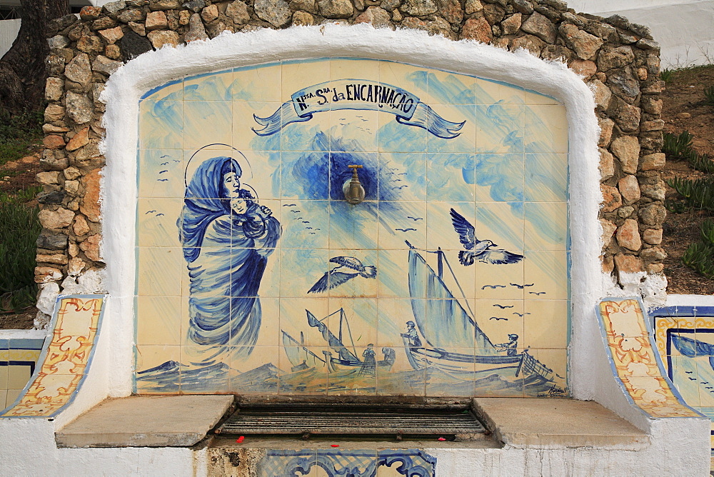 Historic fountain with Azulejos tiles in Carvoeiro, Algarve, Portugal