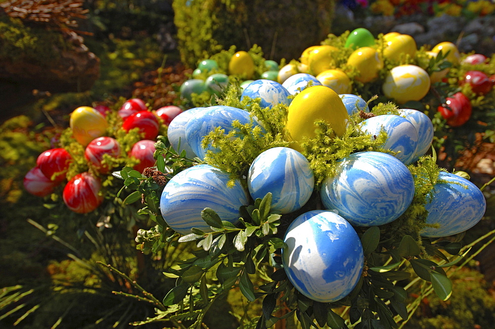 Easter decorations (easter eggs) on a fountain, Bieberach, Franconian Switzerland region, Bavaria, Germany, Europe